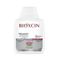 شامبو Bioxcin العشبي 300 مل لتساقط الشعر للشعر الدهني