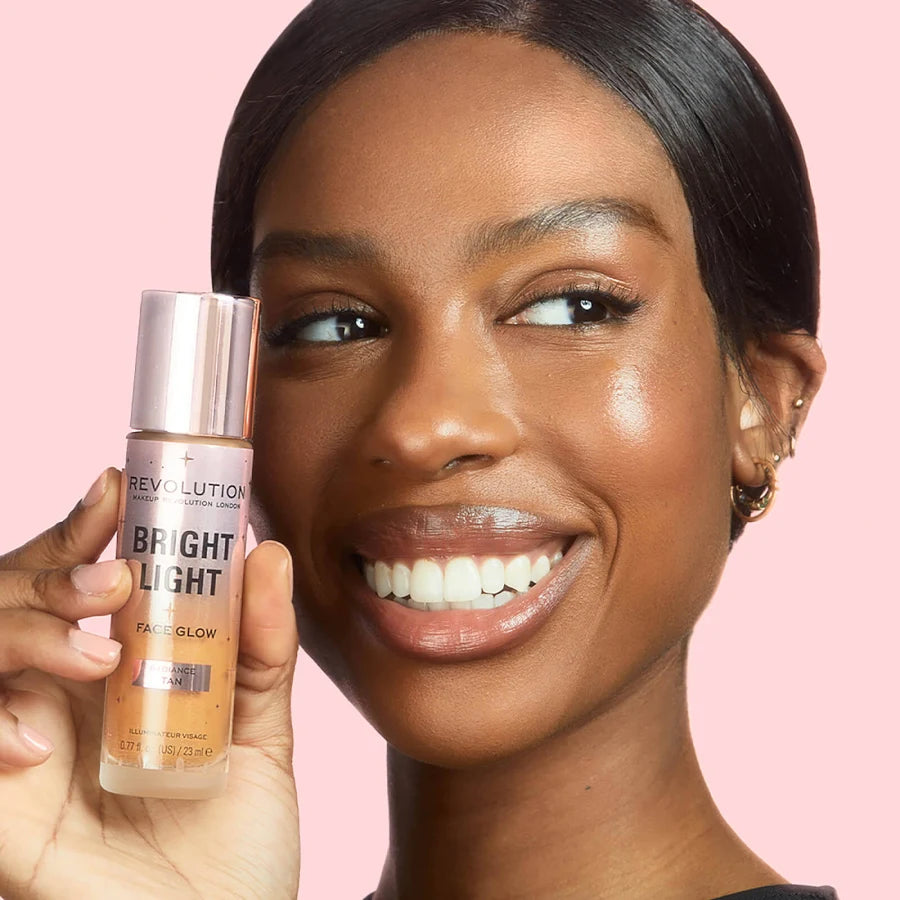 كريم أساس Revolution Bright Face Glow – تشطيب مشع ندي بلون تان مشع